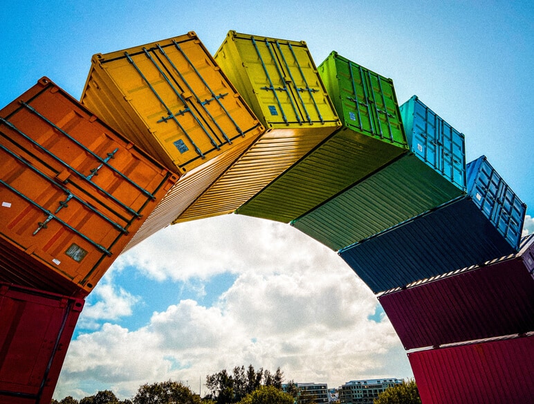 Colourful sea containers displayed in a 'rainbow' arc in Fremantle, Perth