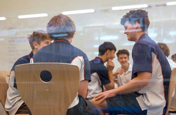 Class of teenage boys taking part in a kai-fella school workshop